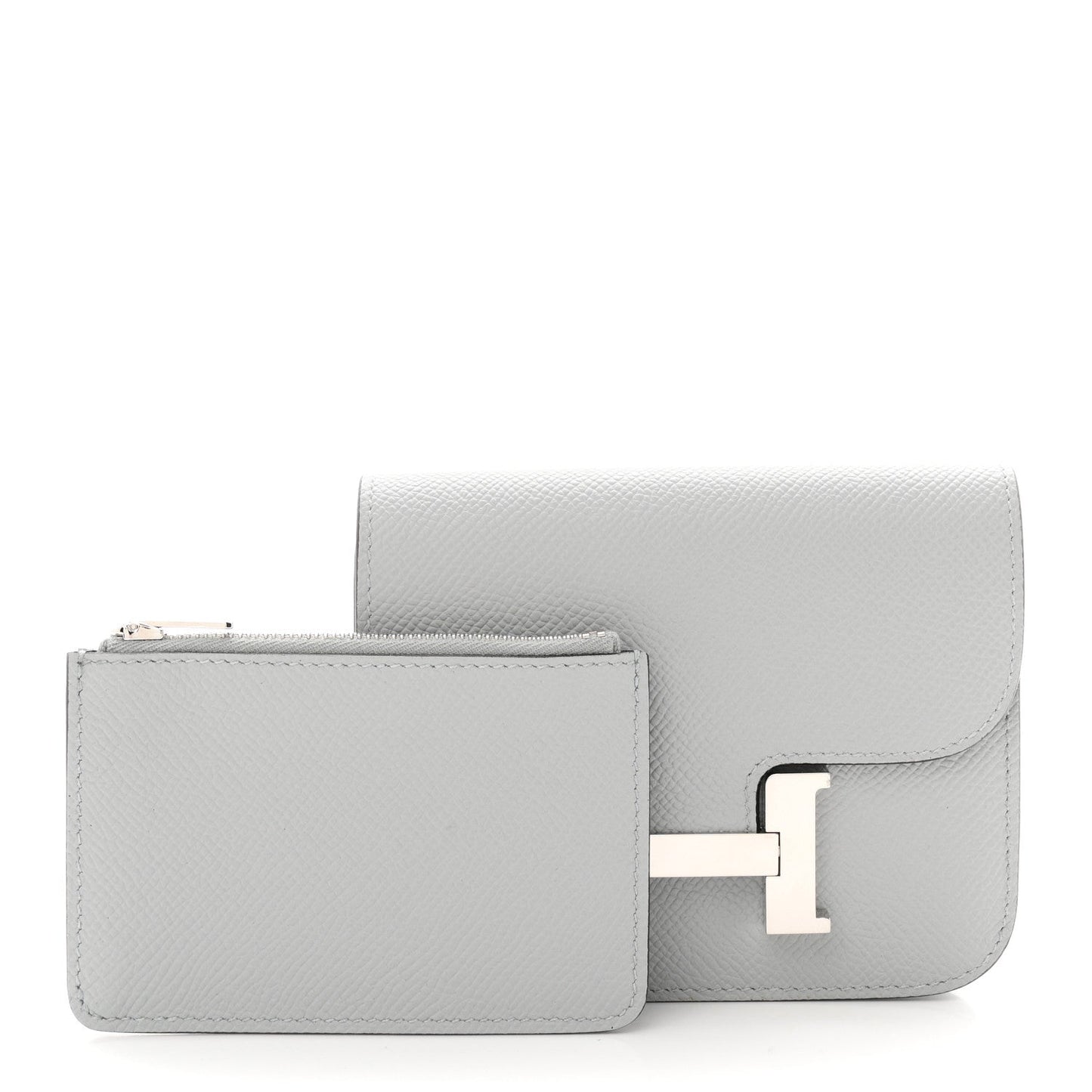 Hermes Constance slim wallet, light blue textured leather, side view with flap and clasp.