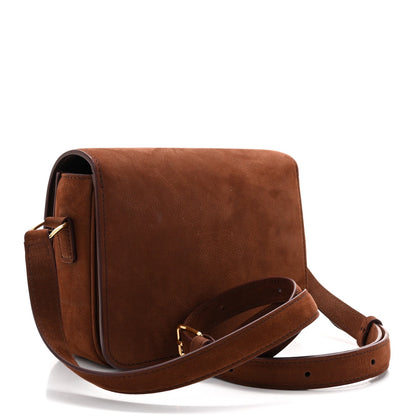 Chestnut shoulder bag with adjustable strap, side buckle, and top flap