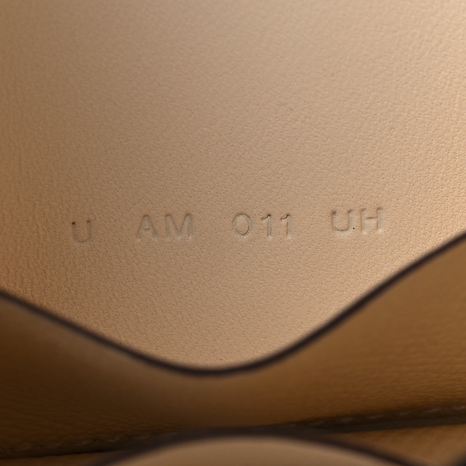 Hermes Nata leather wallet interior with stamped code marking