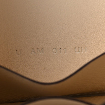 Hermes Nata leather wallet interior with stamped code marking