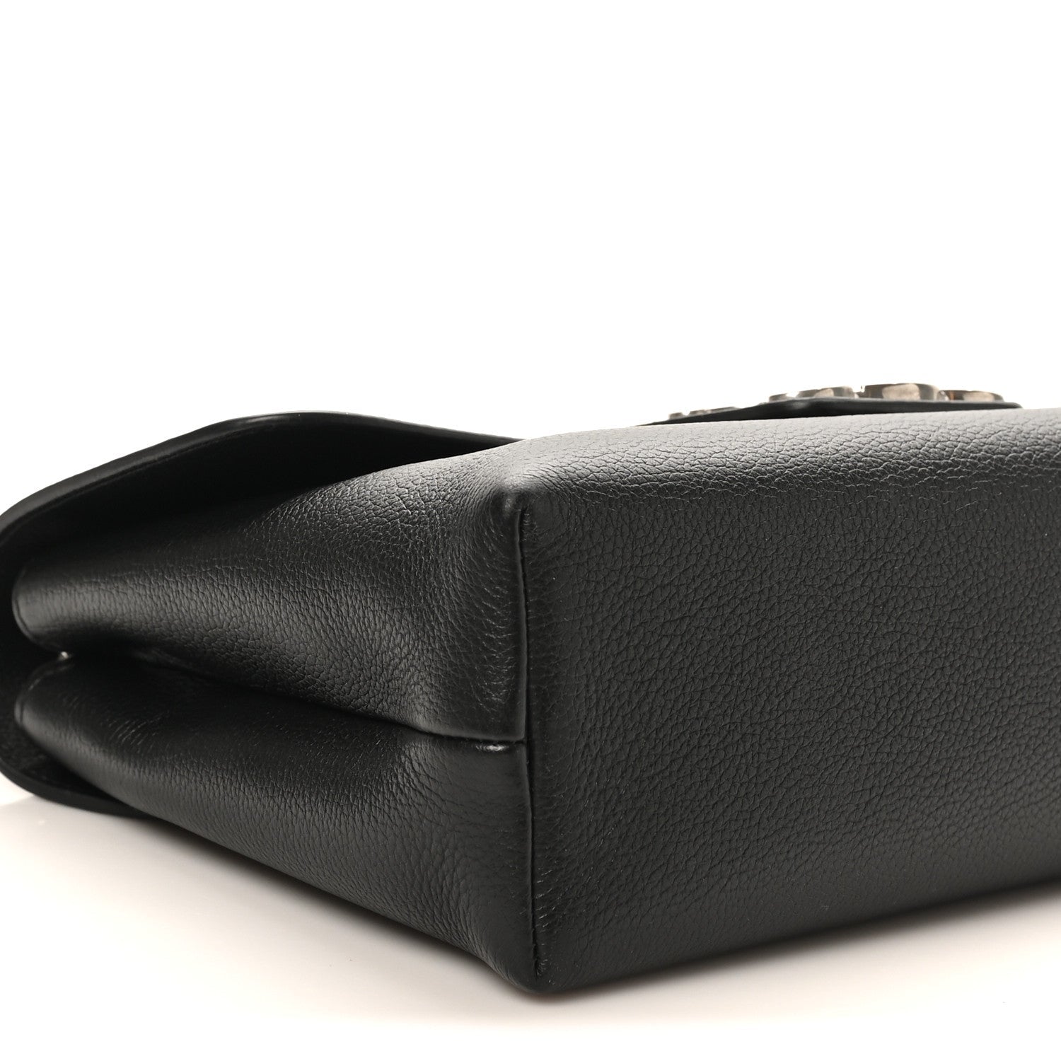 Black calfskin bag bottom corner with smooth leather edge