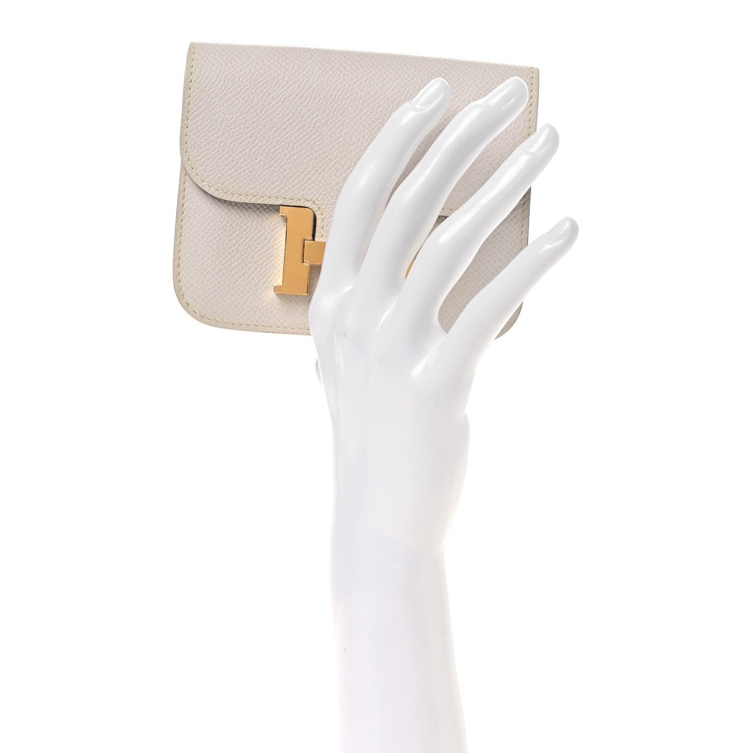 Pale gray leather slim wallet with open card slots and gold-tone H clasp