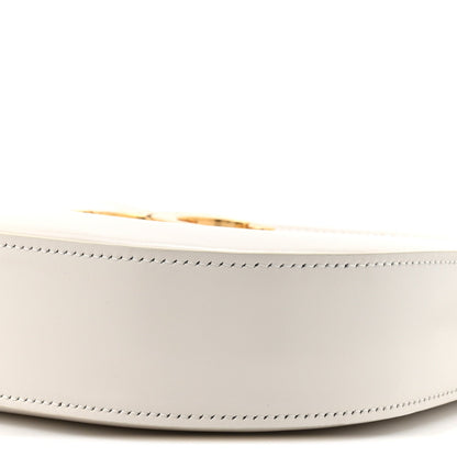 Rice cream leather bag side with zipper top edge and stitched seam detail