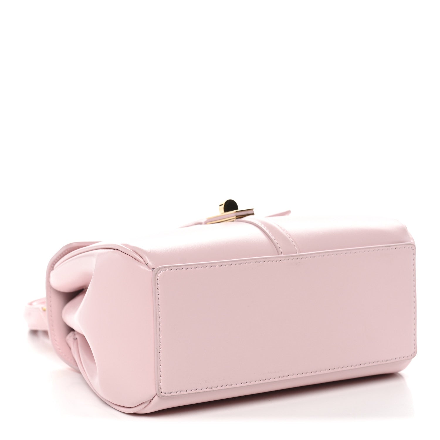 Pastel pink mini top-handle bag with back panel, rolled handle, and gold top clasp