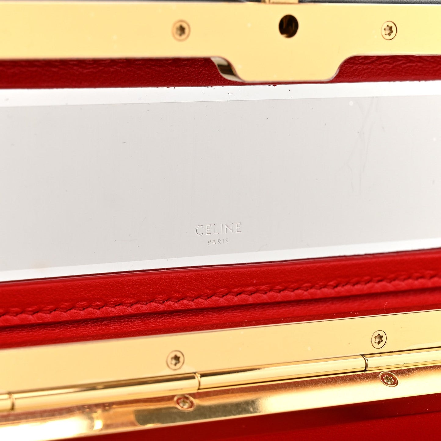 Black leather rectangle bag open, showing red lining and Celine stamp